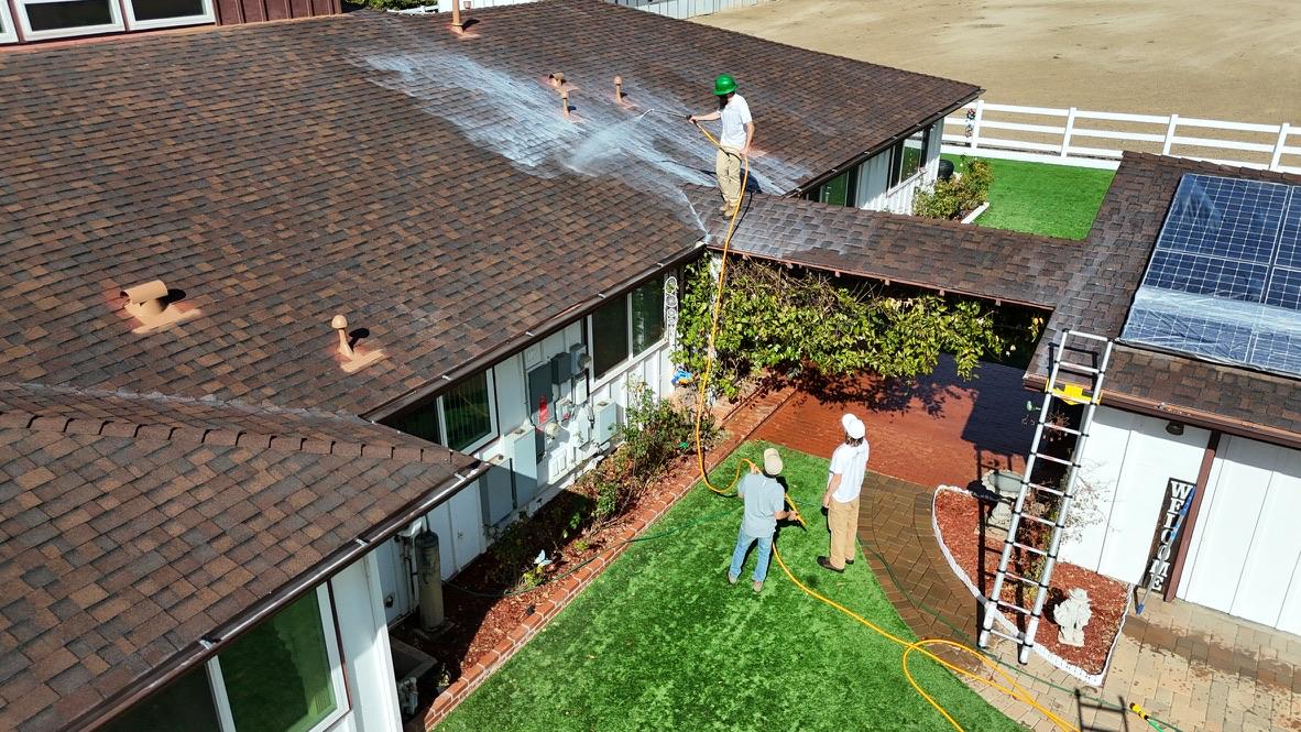 Roof Maxx team applying treatment — aerial view
